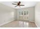 Bedroom featuring a ceiling fan and french doors to the exterior at 140 Margate Mews, Longwood, FL 32779