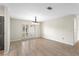 Open dining area with tile flooring, chandelier, and a view of the front yard at 140 Margate Mews, Longwood, FL 32779