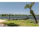 Community dock with a gazebo on a serene lake, perfect for leisure and relaxation at 140 Margate Mews, Longwood, FL 32779