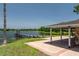 Community dock and covered outdoor area overlooking the scenic lake at 140 Margate Mews, Longwood, FL 32779