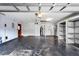 Spacious garage featuring shelving and storage at 140 Margate Mews, Longwood, FL 32779