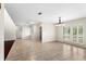 Spacious living room with tile floors and a view of the front yard at 140 Margate Mews, Longwood, FL 32779