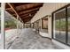 The screened-in patio features wood ceiling and tile flooring at 140 Margate Mews, Longwood, FL 32779