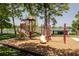 Playground features a colorful play structure near the lake in a beautiful community at 140 Margate Mews, Longwood, FL 32779