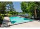 Community pool overlooking a scenic lake, offering a refreshing outdoor amenity at 140 Margate Mews, Longwood, FL 32779