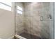 Contemporary shower with glass door and updated tile work at 140 Margate Mews, Longwood, FL 32779