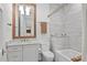 Bathroom featuring a marble vanity top, a modern sink, and a tile backsplash at 1429 Indiana Ave, Winter Park, FL 32789