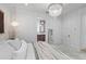 Bedroom featuring a decorative hanging light, a doorway to an ensuite bath, and a view from the bed at 1429 Indiana Ave, Winter Park, FL 32789