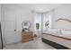 This bedroom features large windows for natural light, a decorative mirror, and modern furnishings at 1429 Indiana Ave, Winter Park, FL 32789