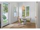 Cozy breakfast nook with lots of natural light, round table and seating for four at 1429 Indiana Ave, Winter Park, FL 32789