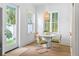 Bright breakfast nook with a round table, four chairs, and natural lighting at 1429 Indiana Ave, Winter Park, FL 32789