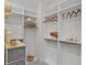 Well-organized walk-in closet with ample shelving, hanging space, and neutral-toned decor at 1429 Indiana Ave, Winter Park, FL 32789