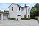 Contemporary two-story house with a gray driveway, two-car garage and manicured landscaping at 1429 Indiana Ave, Winter Park, FL 32789