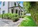 Stunning two-story home with a manicured lawn, lush landscaping, and a welcoming walkway at 1429 Indiana Ave, Winter Park, FL 32789