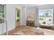 Bright foyer featuring hardwood floors, a stylish area rug, and natural light from the large front door at 1429 Indiana Ave, Winter Park, FL 32789