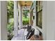 Charming covered front porch with comfortable seating and decorative accents at 1429 Indiana Ave, Winter Park, FL 32789