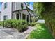 Charming home with lush landscaping, stone pathway, and privacy bushes at 1429 Indiana Ave, Winter Park, FL 32789