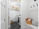 Laundry room with black herringbone tile flooring and front load washer and dryer at 1429 Indiana Ave, Winter Park, FL 32789