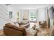 Cozy living room with comfortable seating, a stylish coffee table, and plenty of natural light at 1429 Indiana Ave, Winter Park, FL 32789