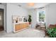 Bright living room with natural light, decorative shelving, and stylish decor at 1429 Indiana Ave, Winter Park, FL 32789