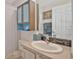Bathroom with sink and faucet, vanity, mirror and combination shower/tub at 149 Acadia Dr, Kissimmee, FL 34759