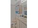 Bathroom with sink and faucet, vanity, mirror and combination shower/tub at 149 Acadia Dr, Kissimmee, FL 34759