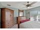 Well-lit bedroom with a spacious closet, dresser, and cozy carpeting at 149 Acadia Dr, Kissimmee, FL 34759
