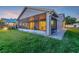 Home exterior showcasing the screened-in patio and well-manicured lawn at 149 Acadia Dr, Kissimmee, FL 34759