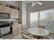 Kitchen featuring stainless steel appliances, neutral countertops, and a cozy breakfast nook with natural light at 149 Acadia Dr, Kissimmee, FL 34759