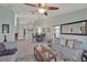 Bright living room showcasing neutral paint, and ample seating for relaxation and entertainment at 149 Acadia Dr, Kissimmee, FL 34759