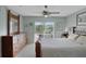 Spacious main bedroom offering a ceiling fan, closet space, and a sliding glass door to the backyard at 149 Acadia Dr, Kissimmee, FL 34759
