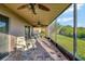 Inviting screened patio with brick flooring, comfortable seating, and ceiling fans at 149 Acadia Dr, Kissimmee, FL 34759