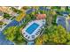 Aerial shot of a beautiful community pool with lounge chairs and well-kept landscaping at 149 Acadia Dr, Kissimmee, FL 34759