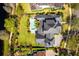 Aerial view of a home with lush greenery and a private pool creating a serene outdoor space at 1590 Harston Ave, Orlando, FL 32814