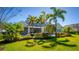 A sprawling backyard with a refreshing pool and meticulous landscaping creates a private oasis at 1590 Harston Ave, Orlando, FL 32814