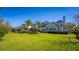 Expansive green backyard features mature trees and landscaping, offering a private and serene outdoor space at 1590 Harston Ave, Orlando, FL 32814