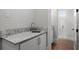 Stylish powder room includes a granite countertop and a walk-in shower at 1590 Harston Ave, Orlando, FL 32814