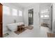 Bathroom featuring a freestanding tub, walk-in shower, and neutral color palette at 1590 Harston Ave, Orlando, FL 32814