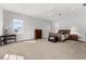Spacious bedroom boasts neutral colors, a ceiling fan, and lots of sunlight at 1590 Harston Ave, Orlando, FL 32814