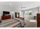 Spacious bedroom with large windows, a ceiling fan and ensuite bathroom entrance, offering plenty of natural light at 1590 Harston Ave, Orlando, FL 32814
