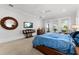 Bedroom with a large bed, modern ceiling fan, and access to an outdoor patio at 1590 Harston Ave, Orlando, FL 32814