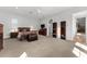 A large, carpeted bedroom has lots of storage space and an attached bathroom at 1590 Harston Ave, Orlando, FL 32814