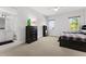Bedroom features a ceiling fan, en suite bathroom, and lots of natural light at 1590 Harston Ave, Orlando, FL 32814