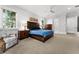 Bright bedroom boasts an elegant bedframe, ceiling fan, and lots of natural light at 1590 Harston Ave, Orlando, FL 32814