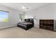 Bright bedroom features large windows, a ceiling fan, and an organized storage unit at 1590 Harston Ave, Orlando, FL 32814