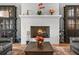 Charming fireplace with a decorative mantle, flanked by cabinets and comfortable furniture at 1590 Harston Ave, Orlando, FL 32814