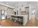 Spacious kitchen boasts stainless steel appliances, a large island with seating, and hardwood flooring at 1590 Harston Ave, Orlando, FL 32814
