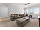 Spacious living room includes plush seating, a ceiling fan, and large windows at 1590 Harston Ave, Orlando, FL 32814