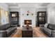 Bright living room with fireplace, hardwood floors, and views of the surrounding landscape at 1590 Harston Ave, Orlando, FL 32814