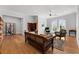 Cozy living room features hardwood floors, neutral walls, and abundant natural light through large arched windows at 1590 Harston Ave, Orlando, FL 32814